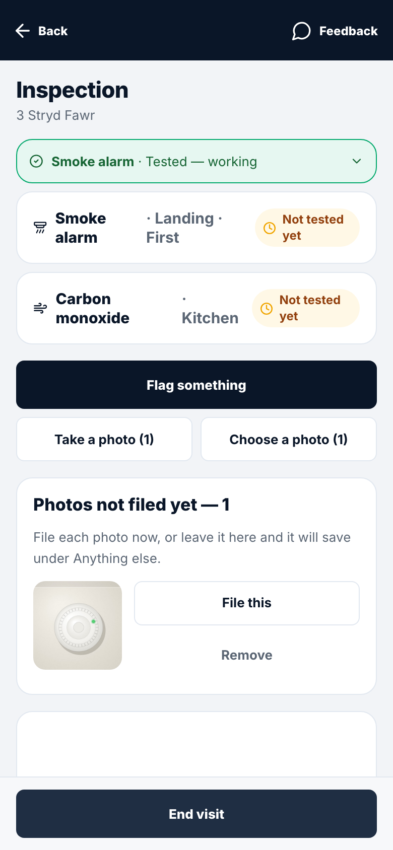 An inspection in progress on a phone: the alarms being checked, with a photo waiting to be filed