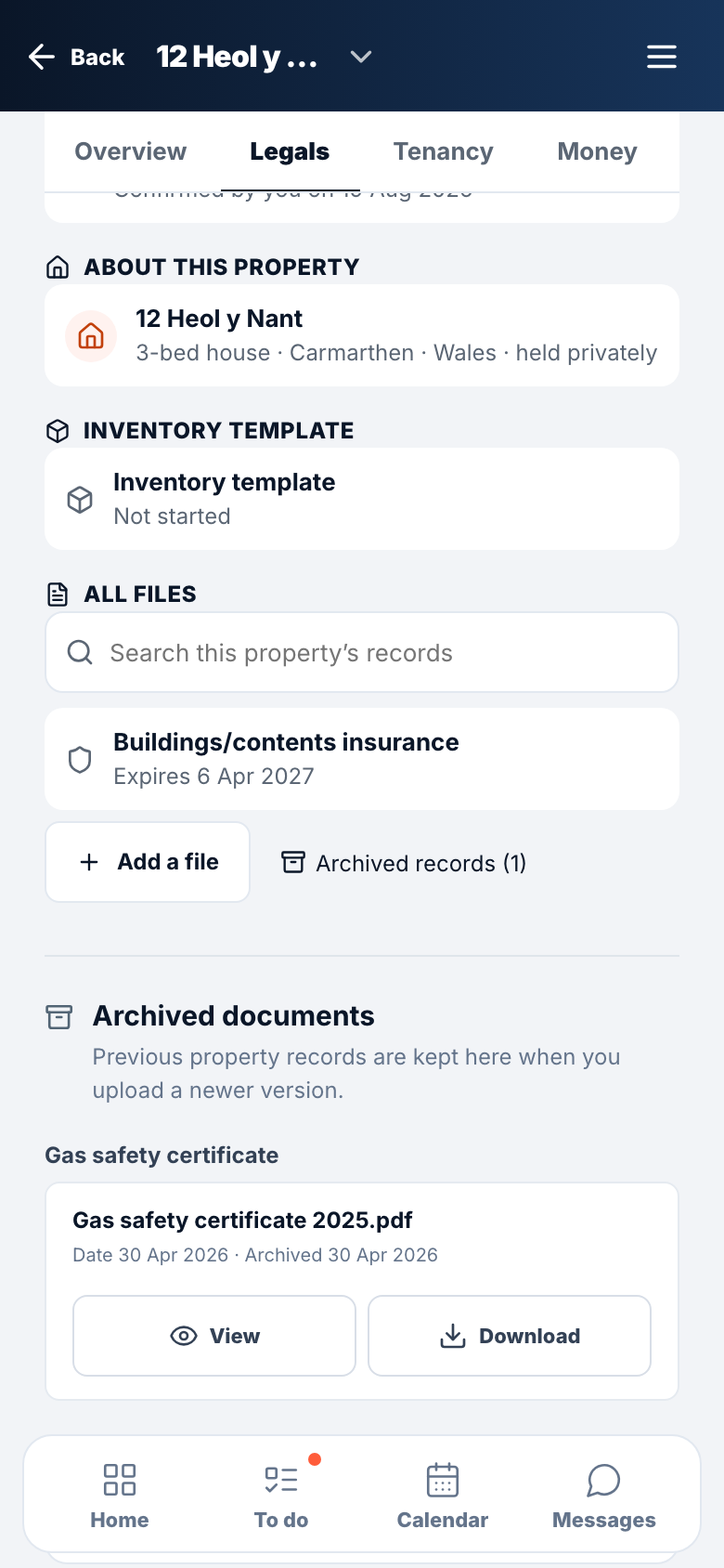 A property's documents on a phone, with a replaced gas certificate in the archive